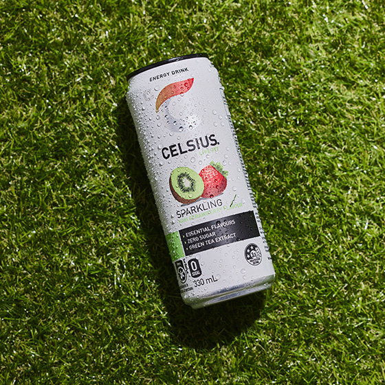 Can of Celsius on a grass a background